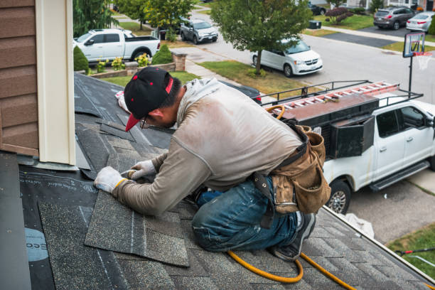 Professional Roofing technician working in Sherborn, MA
